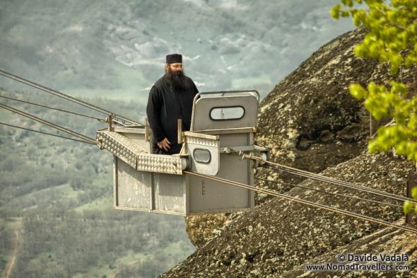 A monk using the cable car in Meteora, Greece