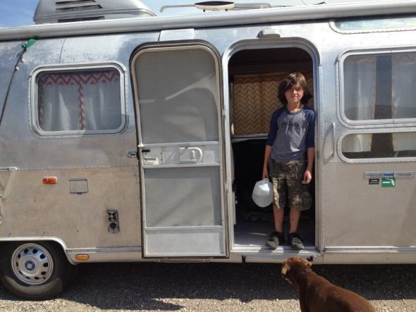 Tristan in front of the RV