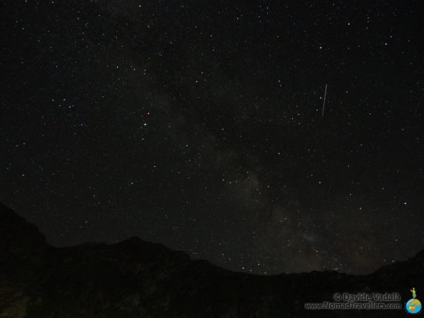 The sky at night at Balea lake, milky way and shooting star