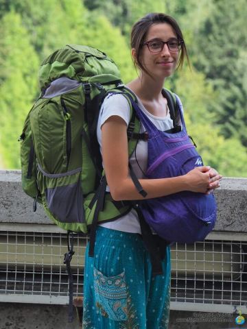 Oti with her luggage while exploring and hitchhiking along the Transfagarasan highway