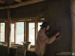 Davide working on clay plaster