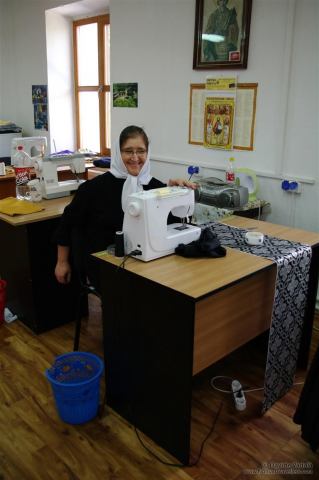 Before leaving we also get a tour of the "backstage" with a noun sewing liturgical clothes for the priest, and the souvenir shop with some free icons and keychains given as a present to us.  010-Monastery-Giurgiu-Romania-Photo-Story0139