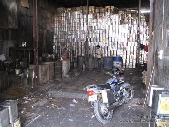 Everything can be recycled in Darhavi slum: here another workshop is recycling oil cans. 041 Mumbai-Bombay-Dharavi-Slum India 3912