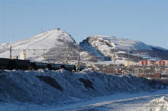 Sign of the extraction are visible at Luossavaara hill where the exploitation of the mine started. Today is not active anymore and it was transformed instead into a ski slope.  Read more: Photo Stories - 1b_Kiruna-iron-ore-mine6618 - Nomad Travellers http://www.nomadtravellers.com/travel-photography/photo-stories/67-kiruna-the-city-of-iron/detail/789-1b-kiruna-iron-ore-mine6618#ixzz2i6rxnsIn 1b Kiruna-iron-ore-mine6618
